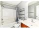 Gray tones throughout this bathroom, which has a tub and shower combination and a sleek single sink vanity at 6479 Enclave Blvd, Greenwood, IN 46143