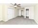Carpeted bedroom with multiple closets and an ensuite bathroom featuring a combination tub and shower at 6479 Enclave Blvd, Greenwood, IN 46143