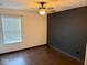 Bedroom with wood floors and a dark shiplap accent wall at 6479 Enclave Blvd, Greenwood, IN 46143