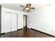 Neat bedroom featuring a ceiling fan, wood flooring, and closet space at 6479 Enclave Blvd, Greenwood, IN 46143