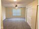 Large bedroom boasts neutral carpet, ceiling fan and closet with louvered doors at 6479 Enclave Blvd, Greenwood, IN 46143