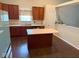 Kitchen featuring an island and stainless steel sink at 6479 Enclave Blvd, Greenwood, IN 46143