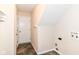 A functional laundry room with slate-look flooring provides a utility door and connections for a washer and dryer at 6479 Enclave Blvd, Greenwood, IN 46143