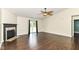 Cozy living area boasts fireplace, ceiling fan, and access to the backyard through sliding glass doors at 6479 Enclave Blvd, Greenwood, IN 46143