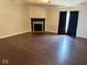 Living room with a fireplace and sliding glass doors to the backyard at 6479 Enclave Blvd, Greenwood, IN 46143