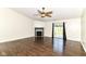 A spacious living room featuring a fireplace, sliding doors to the yard, and modern ceiling fan at 6479 Enclave Blvd, Greenwood, IN 46143