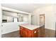View of a home's living room and kitchen area, separated by a half wall and posts at 6479 Enclave Blvd, Greenwood, IN 46143