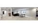 Spacious finished basement with plush carpeting and a comfortable seating area at 6590 W Deerfield Dr, Zionsville, IN 46077