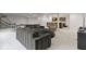 Comfortable seating area in basement with kitchenette and recreational space at 6590 W Deerfield Dr, Zionsville, IN 46077