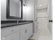 A bathroom with a white vanity, granite countertop, and glass shower at 6590 W Deerfield Dr, Zionsville, IN 46077