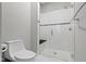 This bathroom features a glass enclosed shower with tile surround and a modern toilet at 6590 W Deerfield Dr, Zionsville, IN 46077