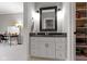 This bathroom has a granite countertop vanity and a framed mirror at 6590 W Deerfield Dr, Zionsville, IN 46077