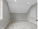 Empty bedroom with angled walls, a window, and carpeted floors at 6590 W Deerfield Dr, Zionsville, IN 46077