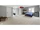 Spacious bedroom with neutral walls, carpet, ceiling detail, a desk, and chair at 6590 W Deerfield Dr, Zionsville, IN 46077
