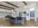 Bright kitchen features an island with seating, pendant lights, and a walk-in pantry at 6590 W Deerfield Dr, Zionsville, IN 46077