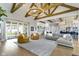 Open floor plan showcasing the living room, kitchen, and access to outdoor living space at 6590 W Deerfield Dr, Zionsville, IN 46077