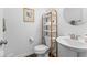 Well-lit half bathroom features a white vanity, modern fixtures, and elegant decor at 6917 Wheatley Rd, Whitestown, IN 46075