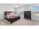 Bedroom with a ceiling fan, two windows, and a dresser at 6917 Wheatley Rd, Whitestown, IN 46075