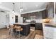 Modern kitchen featuring dark cabinets, stainless steel appliances, granite countertops, and a center island at 6917 Wheatley Rd, Whitestown, IN 46075