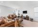 Inviting living room with plush seating, a large window, a modern media center, and neutral decor at 6917 Wheatley Rd, Whitestown, IN 46075