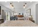 Open-concept kitchen with dark cabinets, stainless steel appliances, center island, and adjacent dining area at 6917 Wheatley Rd, Whitestown, IN 46075