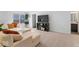Comfortable upstairs loft features a plush sectional sofa and integrated storage, perfect for relaxing with Gathering and friends at 6917 Wheatley Rd, Whitestown, IN 46075