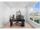 Well-lit home office provides views of the surrounding neighborhood and ample room for working at 6917 Wheatley Rd, Whitestown, IN 46075