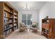 Bright office space with built-in bookshelves, comfortable seating, and a serene atmosphere for focused work at 6917 Wheatley Rd, Whitestown, IN 46075