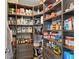 Walk-in pantry with custom shelving providing ample storage for food and kitchen essentials at 6917 Wheatley Rd, Whitestown, IN 46075