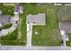 Aerial view of a single Gathering home with a long driveway, RV and boat parking and large grassy yard at 712 Valley Dr, Anderson, IN 46011
