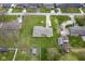 An aerial view of a single Gathering home featuring a large yard, detached garage and RV parking at 712 Valley Dr, Anderson, IN 46011