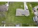 A clear overhead view of the home and surrounding spacious yard in a Gathering-friendly neighborhood at 712 Valley Dr, Anderson, IN 46011