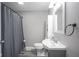 Well-lit bathroom features modern fixtures, gray walls, and stylish vanity at 712 Valley Dr, Anderson, IN 46011