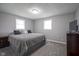 Bedroom features large windows, plush carpet, and neutral gray walls creating a tranquil ambiance at 712 Valley Dr, Anderson, IN 46011