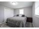 Inviting bedroom featuring plush carpeting, large windows, and neutral gray walls for a soothing ambiance at 712 Valley Dr, Anderson, IN 46011