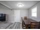 Functional dining area featuring a hardwood table and gray flooring at 712 Valley Dr, Anderson, IN 46011
