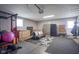 Finished garage space with modern gray walls and an area dedicated to gym equipment at 712 Valley Dr, Anderson, IN 46011