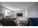 Comfortable living room featuring ample seating and a modern entertainment setup at 712 Valley Dr, Anderson, IN 46011