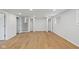 Finished basement with hardwood floors provides ample closet space and a staircase leading to the upper level at 7171 N Orchard Dr, Indianapolis, IN 46236
