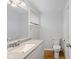 Bathroom with a light gray countertop, white cabinets and walls, and hardwood floors at 7171 N Orchard Dr, Indianapolis, IN 46236