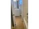 Bathroom with light gray countertop and cabinets, and a hardwood floor at 7171 N Orchard Dr, Indianapolis, IN 46236