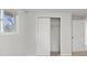 Bedroom with light gray walls, light carpet, a window and closet with sliding doors at 7171 N Orchard Dr, Indianapolis, IN 46236