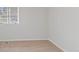 Bedroom with light gray walls, light carpet, and a window at 7171 N Orchard Dr, Indianapolis, IN 46236
