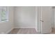 Bedroom with light gray walls, light carpet, a window and closet at 7171 N Orchard Dr, Indianapolis, IN 46236