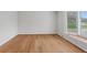Bright living room boasts gleaming hardwood floors and a large bay window allowing for plenty of natural light at 7171 N Orchard Dr, Indianapolis, IN 46236