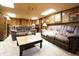 Spacious basement with carpet flooring, comfortable seating, and ample lighting for a cozy living area at 720 22Nd St, Columbus, IN 47201