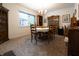 Charming dining room featuring classic furnishings, a chandelier, and a large window at 720 22Nd St, Columbus, IN 47201