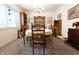 Traditional dining room featuring a round table with seating for six and built-in wooden cabinets at 720 22Nd St, Columbus, IN 47201