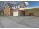 Attached garage and carport showcasing exterior features of the home at 720 22Nd St, Columbus, IN 47201
