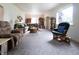 A generous living room featuring neutral walls and carpet and comfortable furniture at 720 22Nd St, Columbus, IN 47201